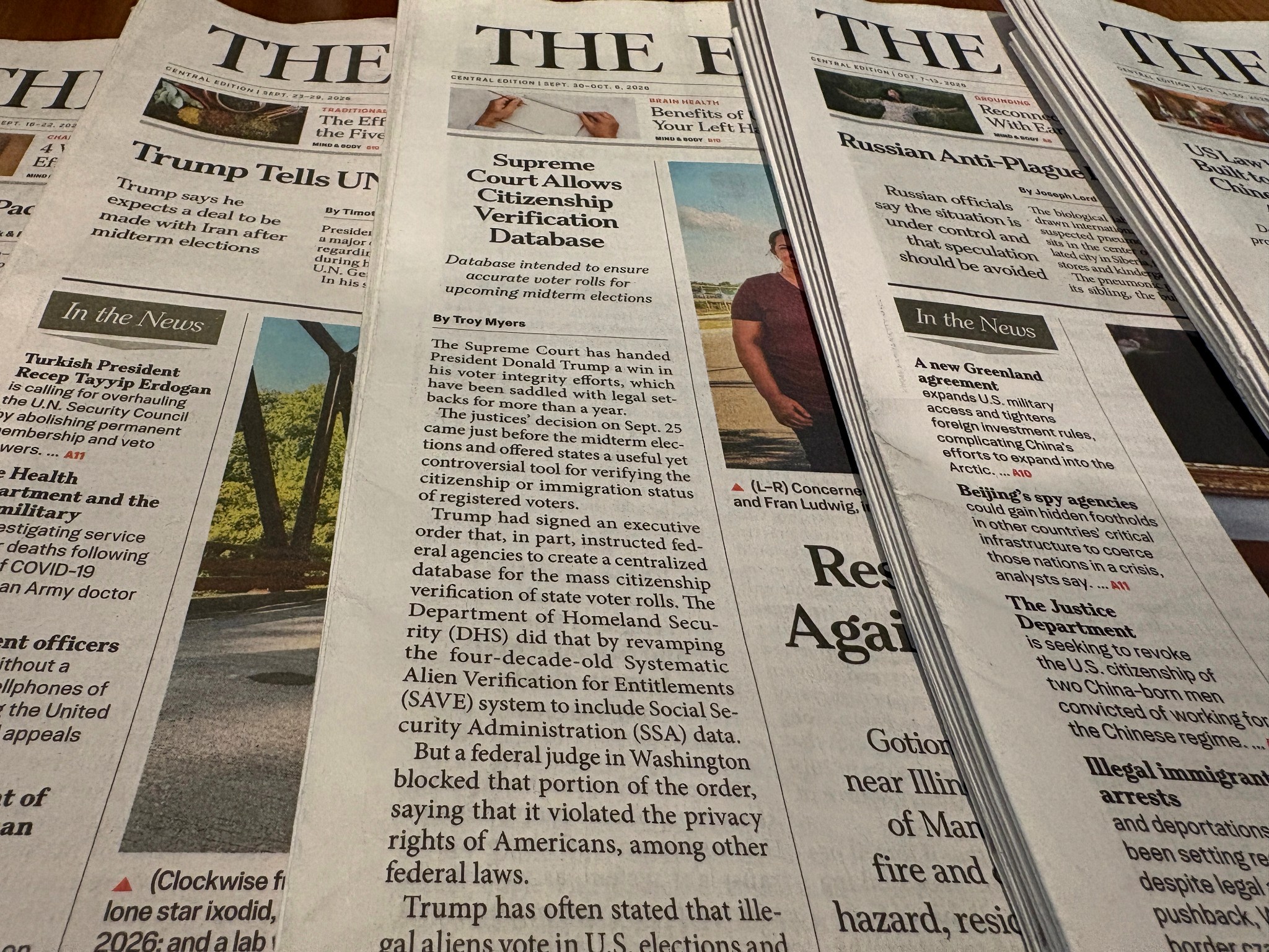 Printed newspapers displayed together